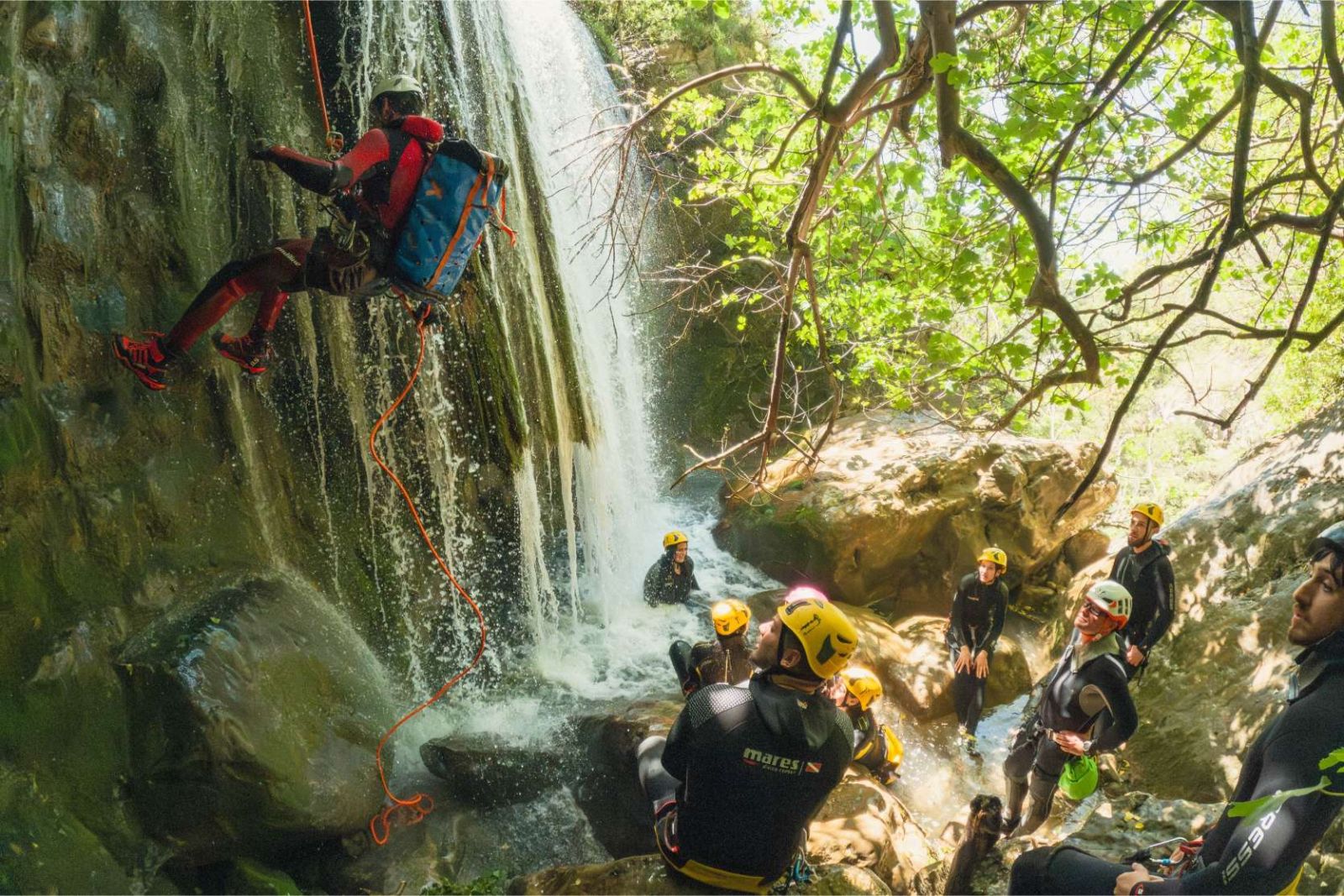 Group crossing a shallow section of the canyon river
